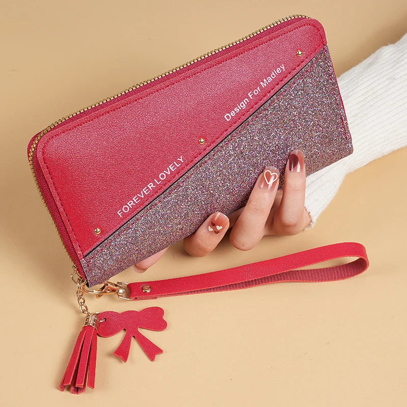 2024 New Purse Long Female Zipper Purse Female Korean Version Of The Patchwork Color Tassel Multi-card Bag Mobile Phone Bag.