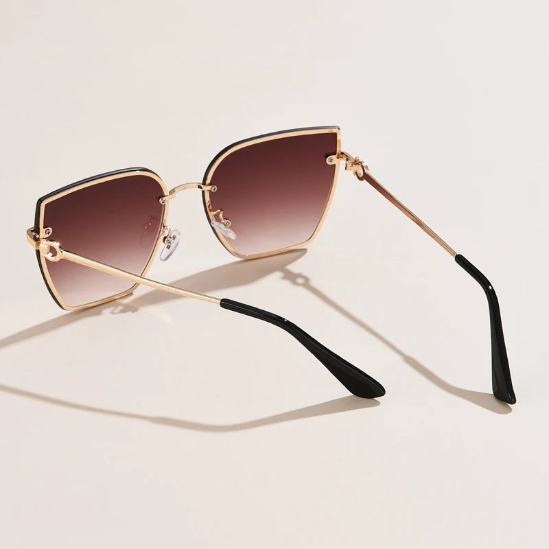 Chic Frameless Cat Eye Sunglasses for Women - Designer Gradient UV400 Shades with Alloy Frame.