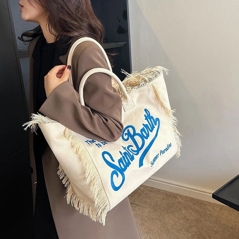 Popular Korean letters tassel canvas bag large-capacity bag simple commuting students to single shoulder Tote bag.